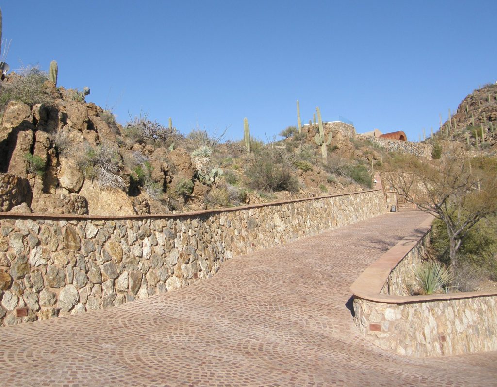 Porphyry Pavers set in overlapping fans create a beautiful and functional design for a steep driveway in Arizona